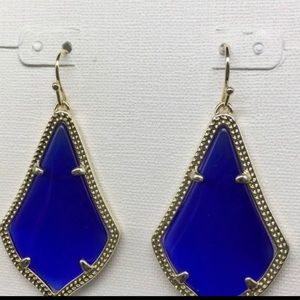 Kendra Scott “Alexandra” earrings in Cobalt Blue set in gold.